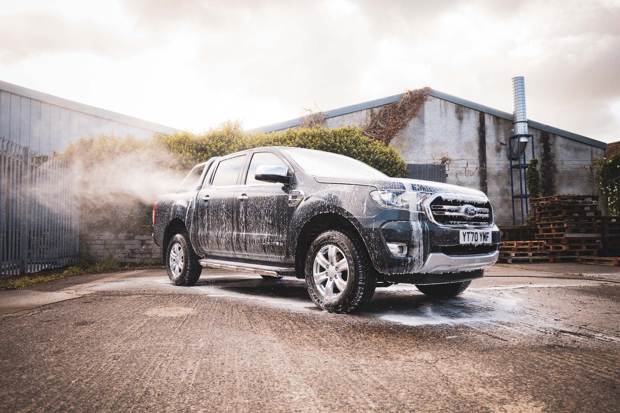 ford ranger covered in snow foam at a car wash